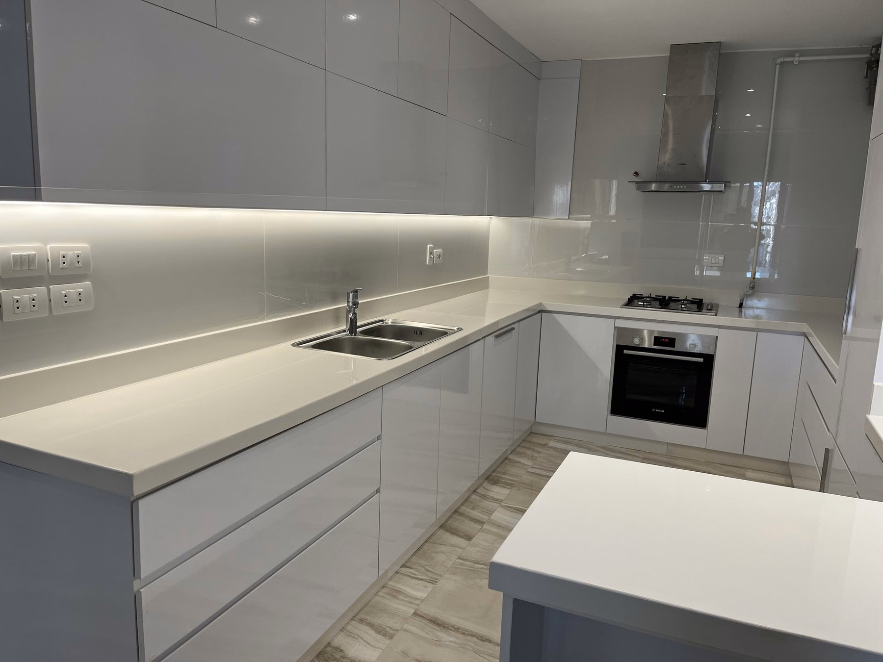 Modern white kitchen in the apartment